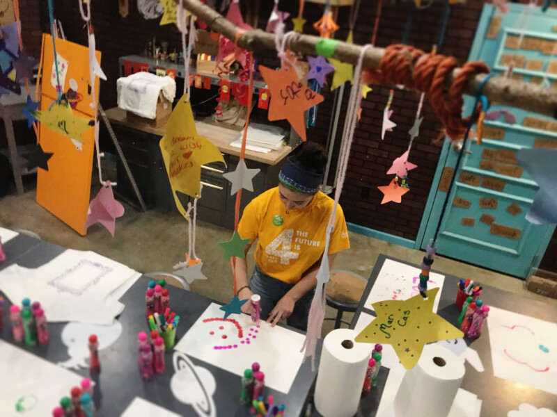 Child creating art at Pre-K Priority event